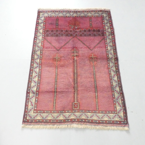 2127 - A red-ground Baluchi rug. 135x90cm