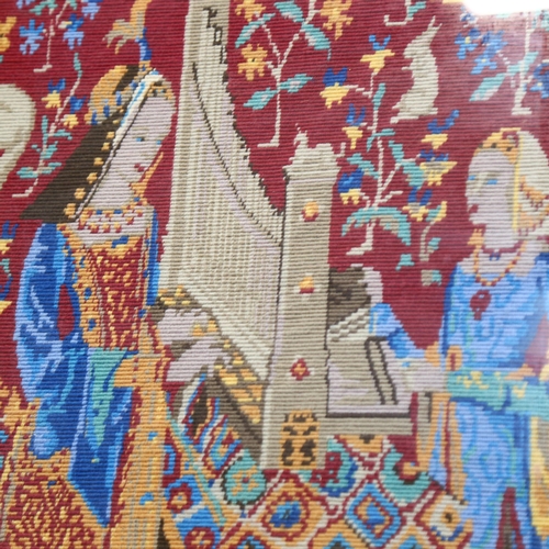 1030 - A tapestry depicting 2 ladies, 52cm x 40cm overall, framed