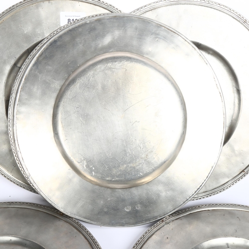 819 - A set of 6 pewter platters, with decorated rims and touch marks, 32cm, with cloth bags