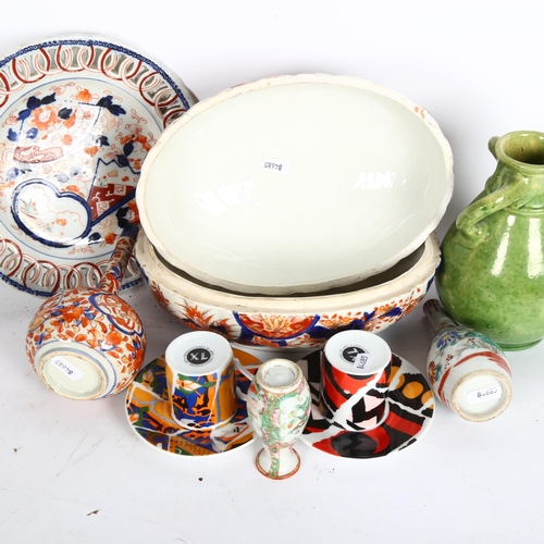 882 - An Imari porcelain tureen and cover, L23cm, vases, pierced plate, and a pair of coffee cans and sauc... 