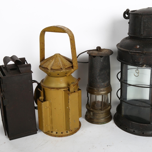 885 - A WWW1 trench lantern, A WWW1Imperial German trench light, antique miners lamp, and a 1944 railway t... 