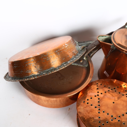 894 - Antique copper pans with iron handles, a copper shovel with turned wood handle etc