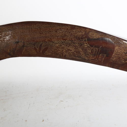 903 - A 1930s Australian carved wood boomerang, plus 2 hardwood African walking sticks, 1 with a Native he... 