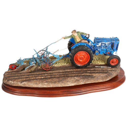 919 - Border Fine Arts sculpture of man and tractor 