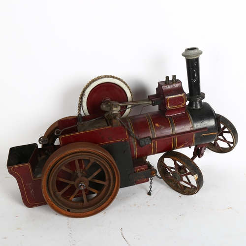 925 - A handmade painted wood model steam engine, with iron-bound wheels and chain-driven movement, H33cm