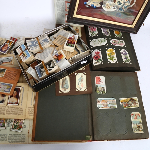 953 - A group of Vintage cigarette cards, various albums and loose cards, and a small framed still life wa... 