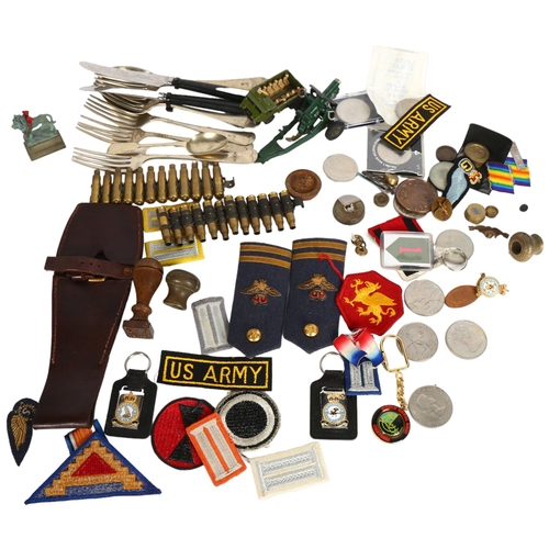 957 - A basket containing various military and other associated items