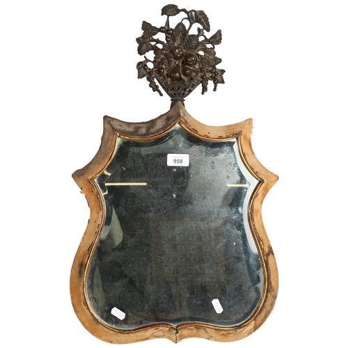 959 - A Victorian dressing table mirror, shield-shaped with bevelled glass, and cast-metal topper decorati... 