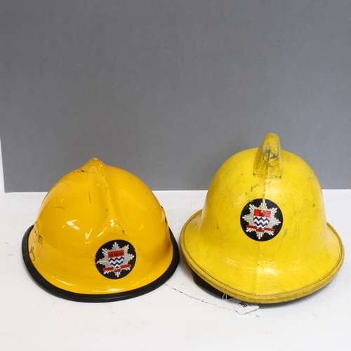 969 - A Greater London Council DB fire tunic, size 100s, order 413/100278, and 2 fireman's helmets, both f... 