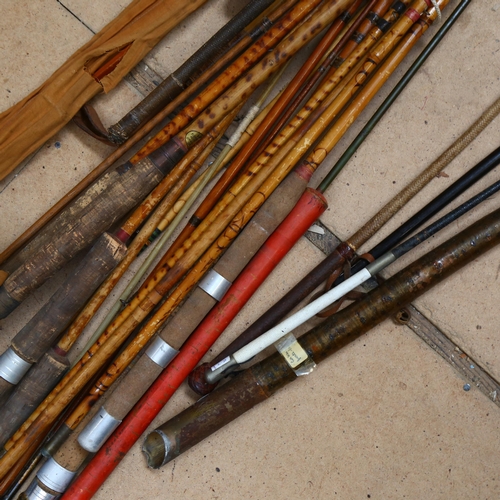 971 - A collection of Vintage bamboo and other fishing rods, walking cane etc