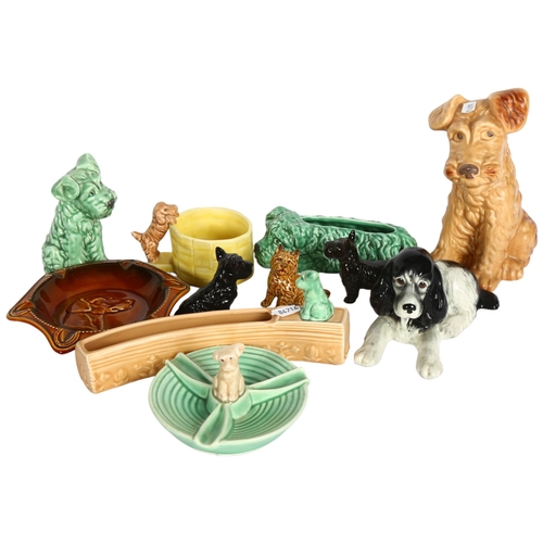 993 - A shelf of Sylvac dog ornaments