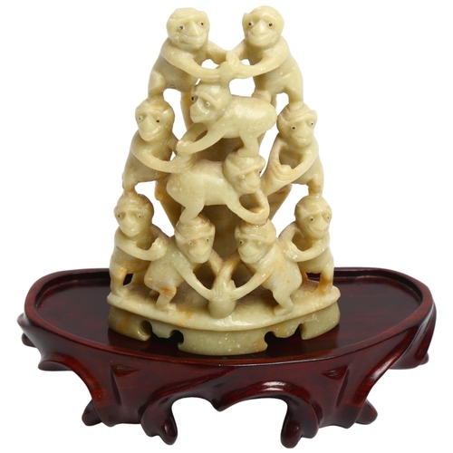 1051 - A Chinese carved soapstone group of monkeys on wood stand, overall height 14cm