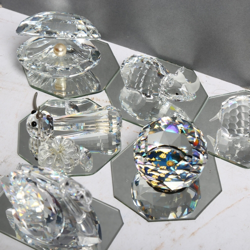 1056 - 4 Swarovski crystal glass ornaments, including hippo, rhinoceros, and a swan, etc, all on separate g... 