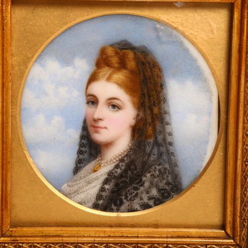 1077 - A 19th century circular miniature, watercolour on porcelain panel, portrait study of a young lady wi... 