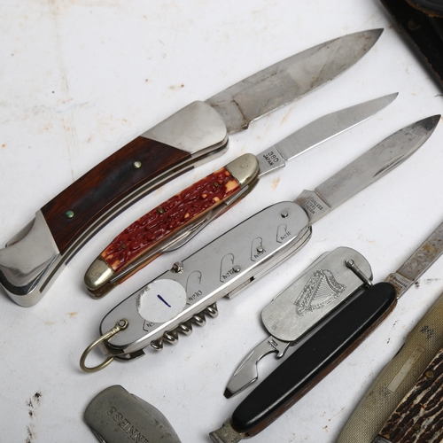 1104 - A group of penknives, various brands, including Buck, Sharp, and various commemorative penknives als... 