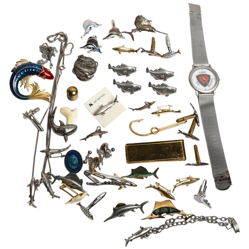 1105 - A group of fishing themed costume jewellery, cufflinks, etc, including some silver items