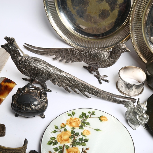 1207 - A white and floral enamelled 3-piece dressing table set, a pair of table pheasants, various plated w... 