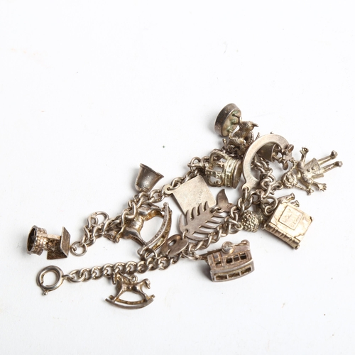 1284 - A silver charm bracelet and charms