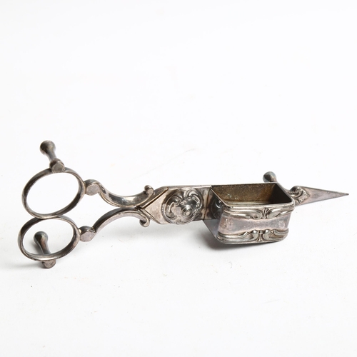 1294 - A Mexican silver compact, a cased silver-mounted brush, another, and a pair of plated candle snuffer... 