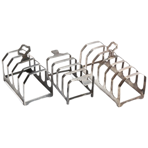 1299 - A group of 3 various silver toast racks