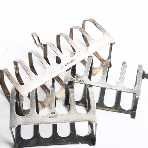 1299 - A group of 3 various silver toast racks