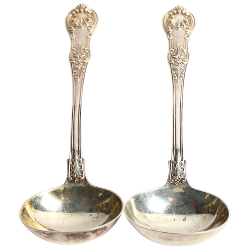 1301 - A pair of Victorian King's pattern silver ladles, L18cm, 5.5oz, hallmarks for London 1863