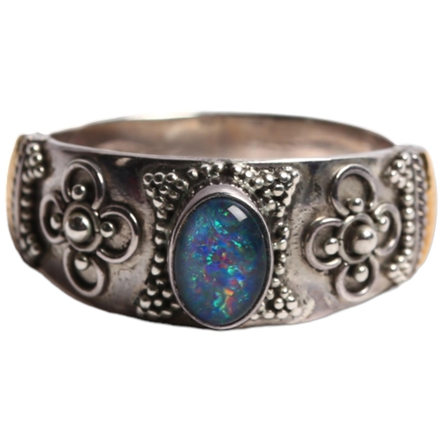 1303 - A 925 silver and 18ct gold banded dress ring, set with an oval opal