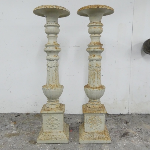 2668 - A pair of cast iron Campana style pricket candlesticks. 20x71cm.