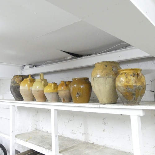 2674 - Eight various vintage French yellow part-glazed stoneware confit pots. Largest 35x35cm.