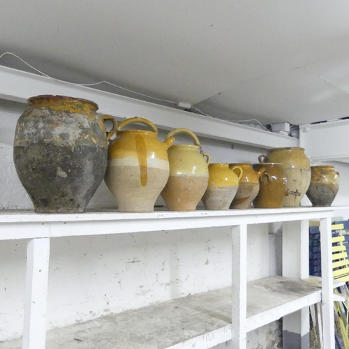 2674 - Eight various vintage French yellow part-glazed stoneware confit pots. Largest 35x35cm.