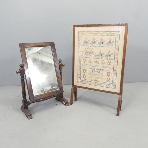 2691 - A George V silver jubilee sampler in glazed fire screen, 46x72cm, and an oak swing dressing mirror. ... 