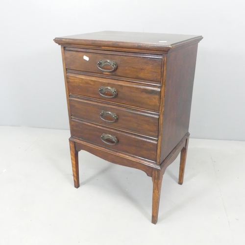 2692 - An early 20th century mahogany music cabinet, with drawer fitted interior containing various sheet m... 