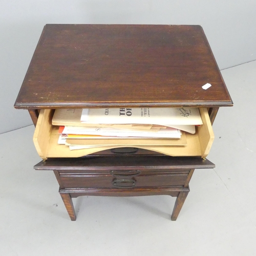 2692 - An early 20th century mahogany music cabinet, with drawer fitted interior containing various sheet m... 