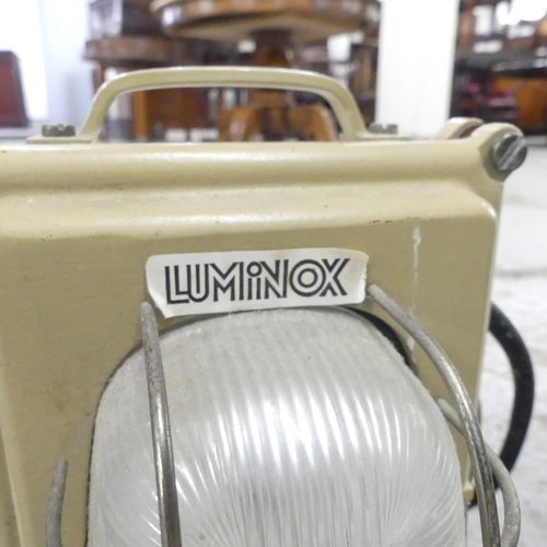 2697 - Two vintage industrial light fittings. Smaller labelled Luminox, larger is enamelled. Largest 47x70c... 