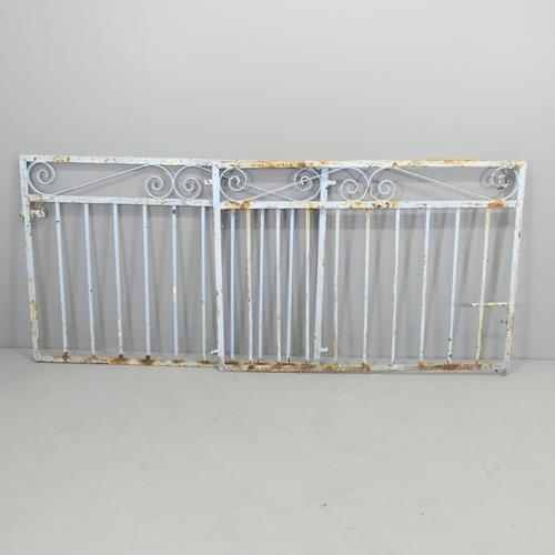 2700 - A pair of painted wrought iron gates. Each 126x87cm.