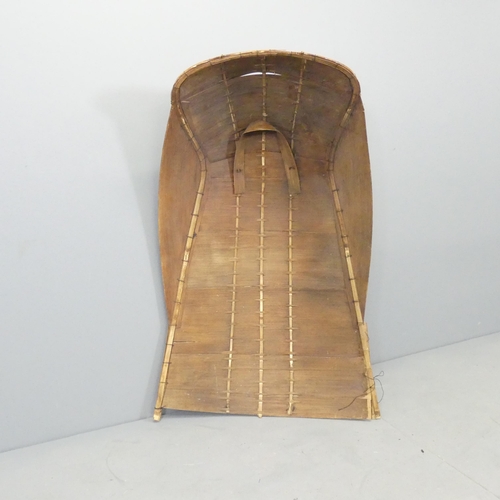 2628 - An oriental rice picker's sun helmet. Height 100cm.