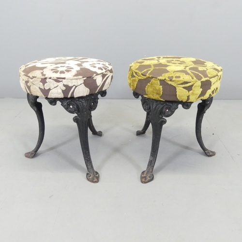 2629 - A pair of upholstered pub stools on cast iron base. 38x43cm.