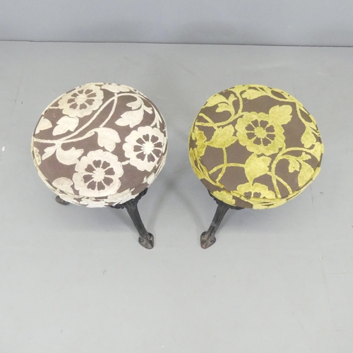 2629 - A pair of upholstered pub stools on cast iron base. 38x43cm.