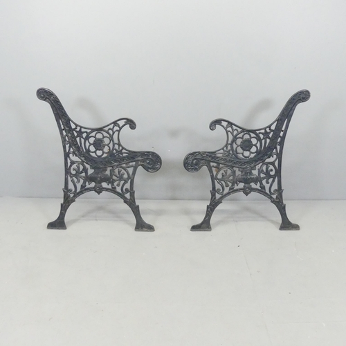 2640 - A pair of cast iron bench ends. Each 65x75cm.