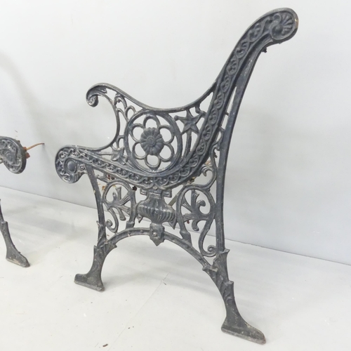 2640 - A pair of cast iron bench ends. Each 65x75cm.