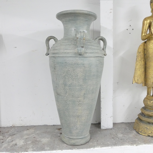 2650 - A large terracotta garden urn, with four handles. 50x102cm.