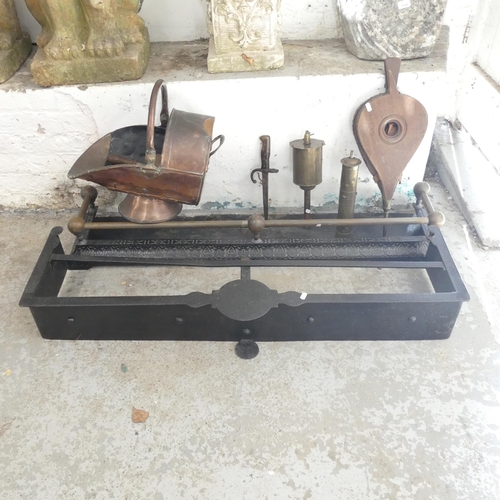 2655 - A group of fireplace items to include two cast iron fire surrounds, largest 105x17x34cm, a copper co... 