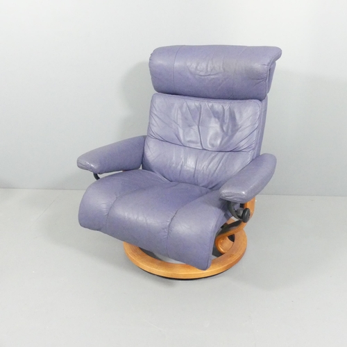 2097 - EKORNES - A Memphis Savannah Stressless reclining swivel lounge chair, upholstered in blue leather, ... 