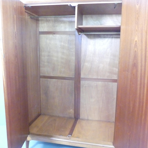 2098 - ALFRED COX - a mid-century teak and satin walnut two-door wardrobe, with rail fitted interior and ma... 