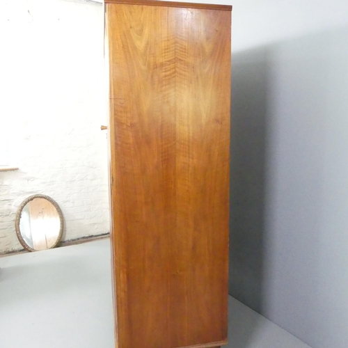 2098 - ALFRED COX - a mid-century teak and satin walnut two-door wardrobe, with rail fitted interior and ma... 