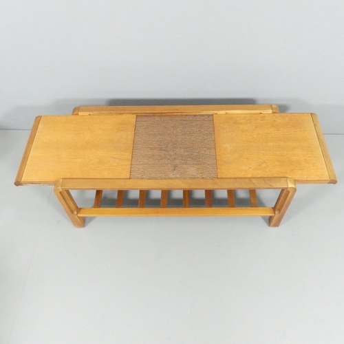 2104 - REMPLOY - A mid-century teak two-tier coffee table, the extending leaves revealing a copper inset pa... 