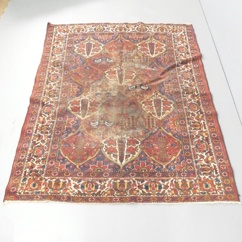 2120 - A red-ground Persian Bakhtiari rug. 205x160cm.