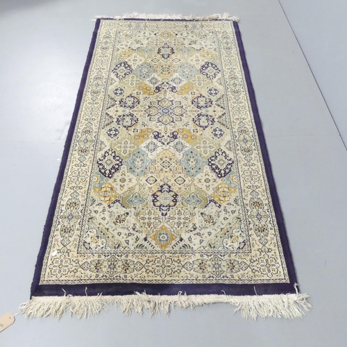 2123 - A cream-ground Persian rug. 198x100cm.