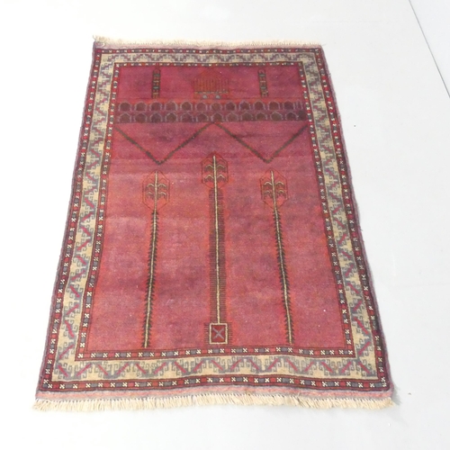 2127 - A red-ground Baluchi rug. 135x90cm