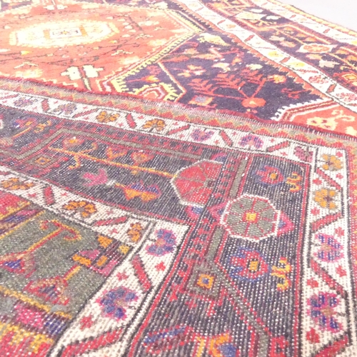 2131 - A red-ground Toserkan Hamadan rug. 228x140cm.